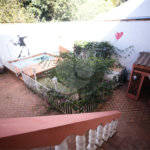 Casa com 4 Dormitórios e área de lazer com piscina