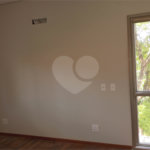 Casa à venda com 4 suítes no condomínio Estância Marambaia, Vinhedo - SP