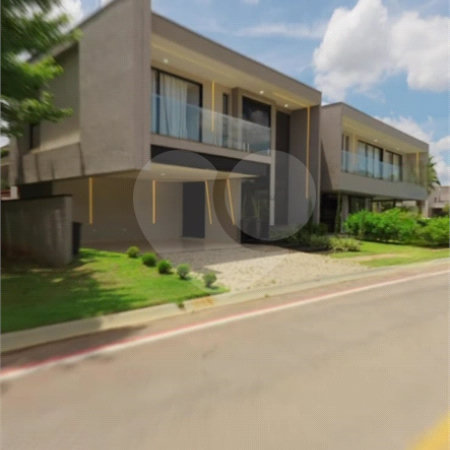 Casa à venda com 4 suítes no condomínio Figueira Garden, Atibaia - SP