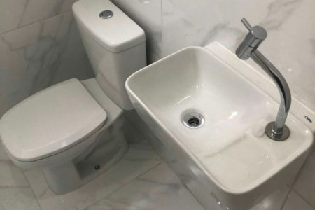 Casa com 3 dormitórios à venda, 116 m² por R$ 690.000,00 - Gonzaga - Santos/SP