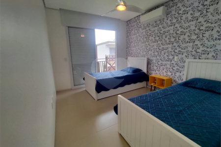 Casa à venda ou para alugar com 4 suítes no condomínio Sambaqui, São Sebastião - SP