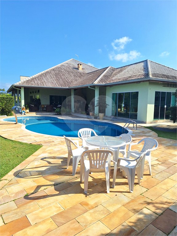 Casa à venda com 4 suítes no condomínio Bougainville, Peruíbe - SP