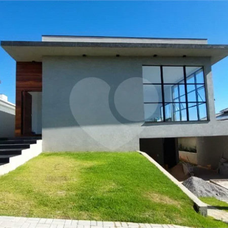 Casa à venda com 4 suítes no condomínio Figueira Garden, Atibaia - SP