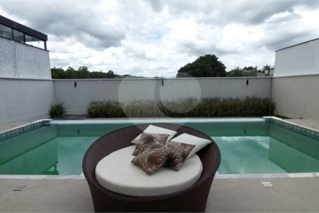 Casa à venda ou para alugar com 4 suítes no condomínio Figueira Garden, Atibaia - SP