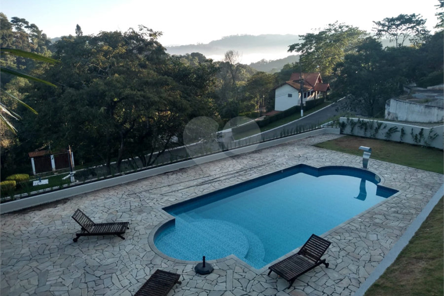 Casa à venda ou para alugar com 4 suítes no condomínio Suíça da Cantareira, Mairiporã - SP