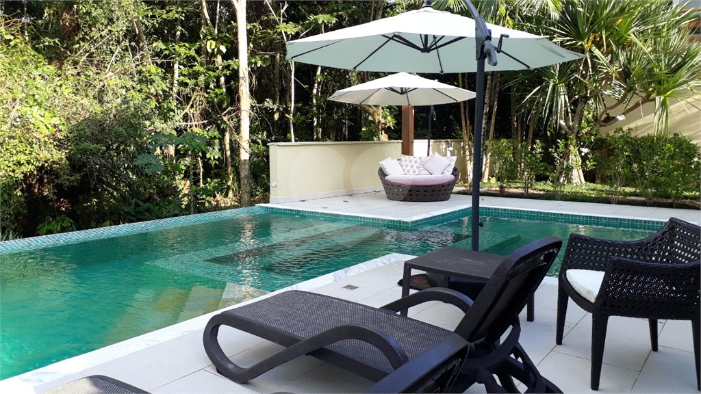 Casa à venda com 4 quartos, sendo 3 suítes, no condomínio Residencial Vila Esmeralda, São Sebastião - SP