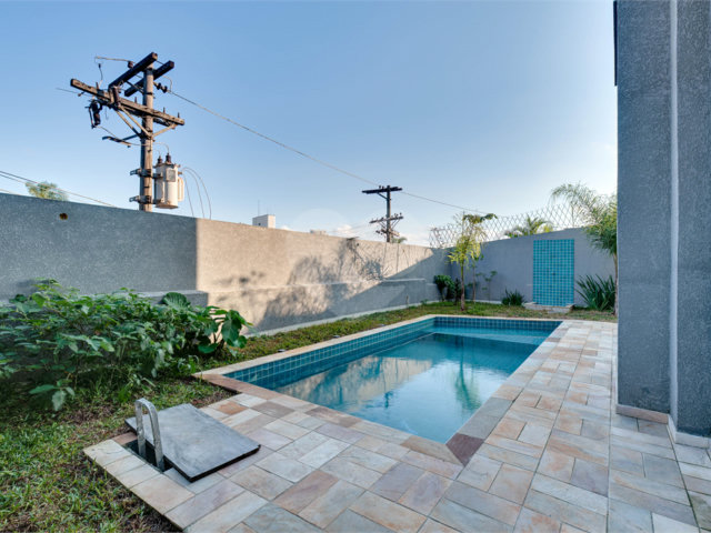 Casa à venda com 4 suítes no condomínio Reserva Robélia, São Paulo - SP