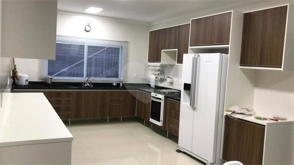 Casa à venda com 4 suítes no condomínio Reserva Ibirapitanga Ii, Santa Isabel - SP