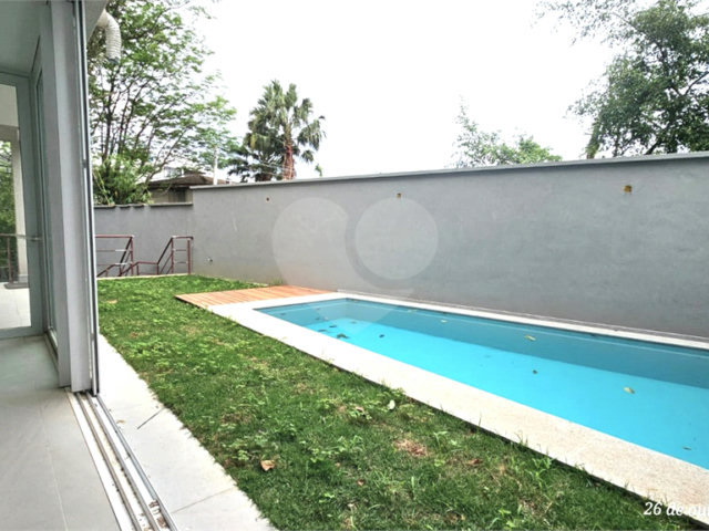 Casa à venda com 4 suítes no condomínio Vila Arese, São Paulo - SP
