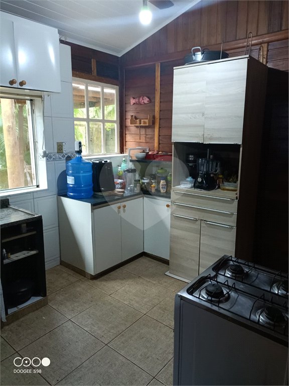 Casa à venda com 4 quartos, sendo 1 suíte,  no condomínio Morada da Praia, Bertioga - SP