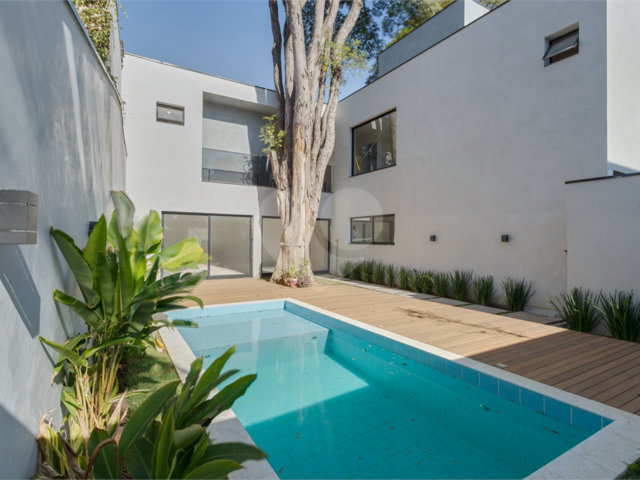 Casa à venda com 4 suítes no condomínio Villa Suiça, São Paulo - SP