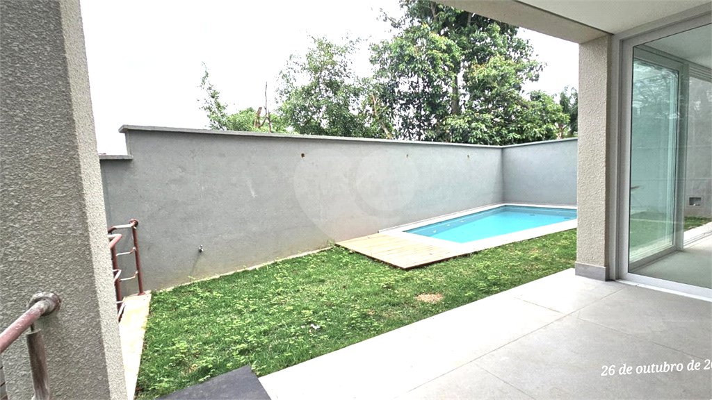 Casa à venda com 4 suítes no condomínio Vila Arese, São Paulo - SP