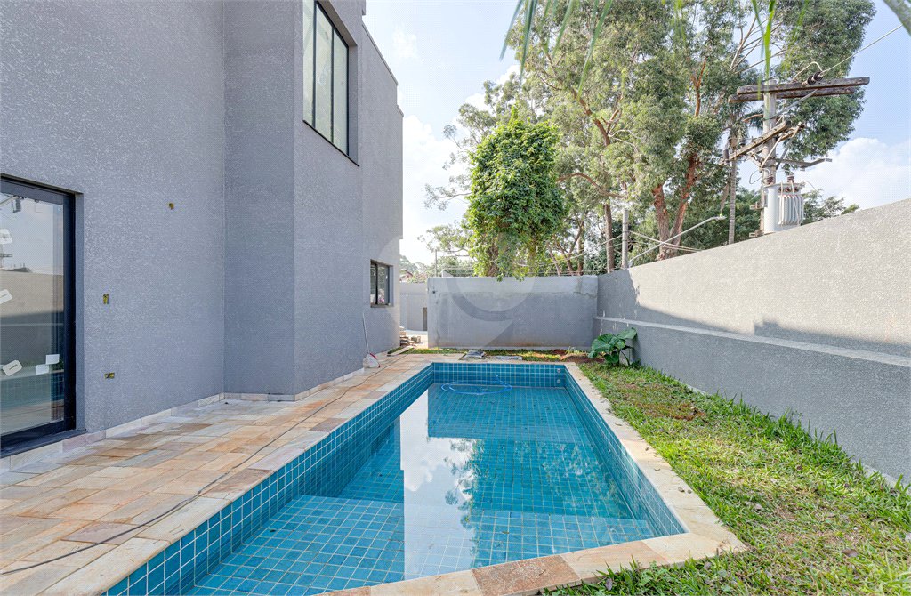 Casa à venda com 4 suítes no condomínio Reserva Robélia, São Paulo - SP