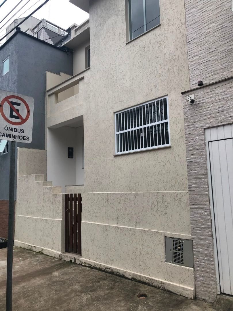 Casa com 3 dormitórios à venda, 116 m² por R$ 690.000,00 - Gonzaga - Santos/SP