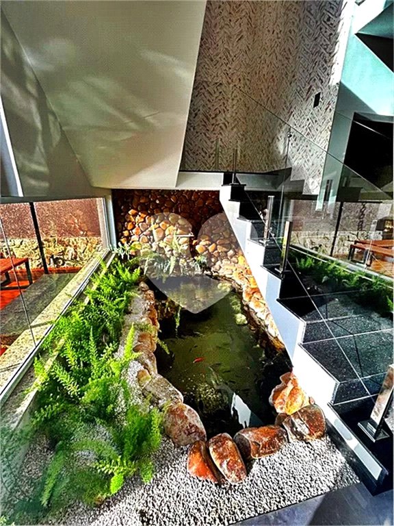 Terreno à venda com 4 suítes no condomínio Suíça da Cantareira, Mairiporã - SP