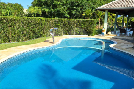 Casa à venda com 4 suítes no condomínio Bougainville, Peruíbe - SP