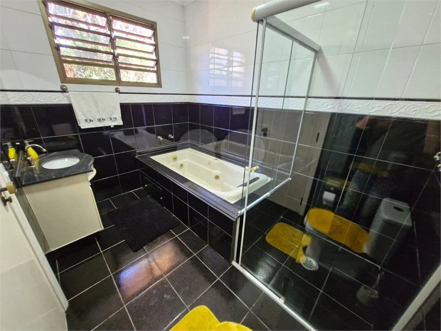 Casa à venda com 4 suítes no condomínio Villa Viana II, Cotia - SP