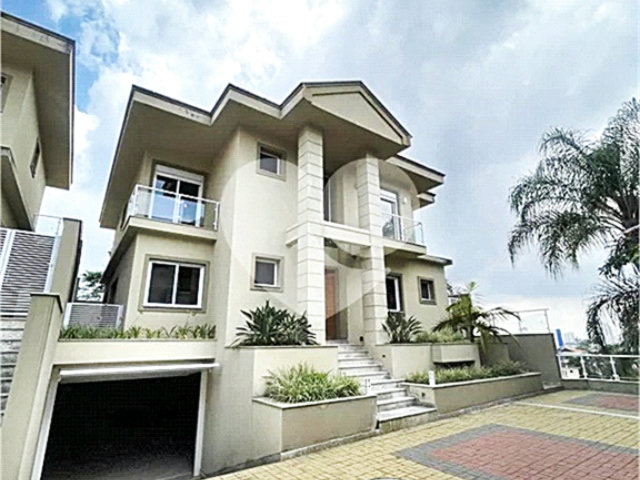 Casa à venda com 4 suítes no condomínio Villagio Di Modena, São Paulo - SP