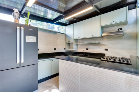 Casa à venda com 4 suítes no condomínio Villa Suiça, São Paulo - SP