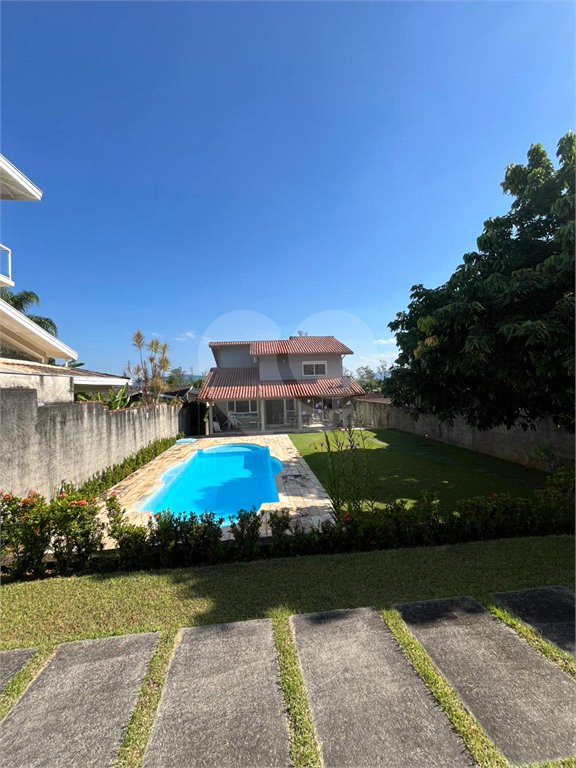 Casa à venda com 2 suítes no condomínio Recanto da Lagoinha, Ubatuba - SP