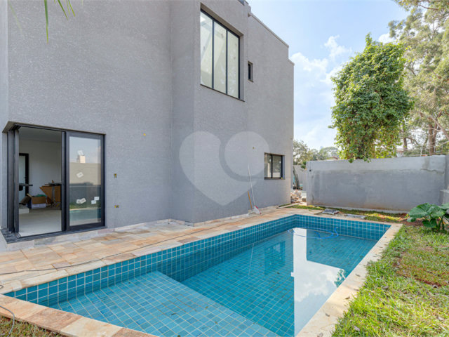 Casa à venda com 4 suítes no condomínio Reserva Robélia, São Paulo - SP