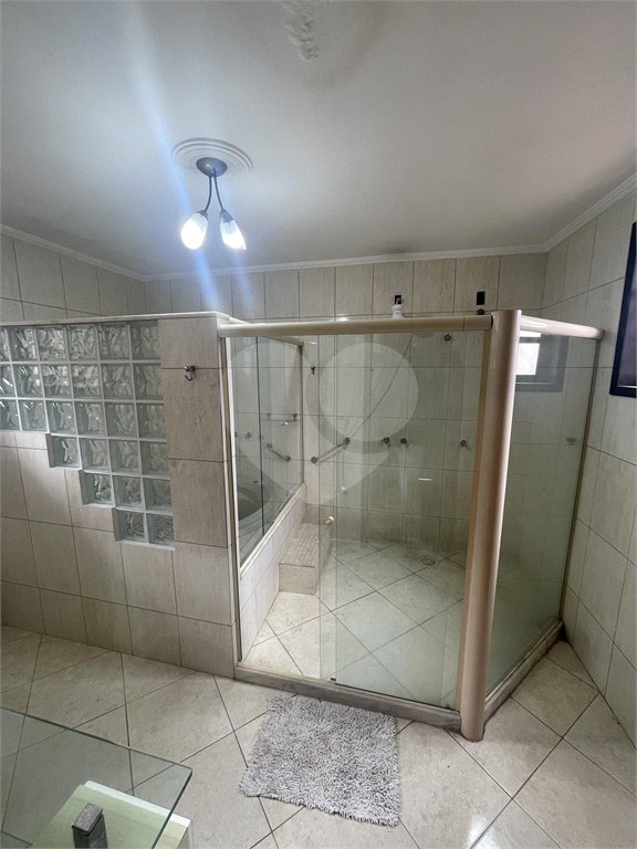 Casa à venda com 5 quartos, sendo 3 suítes, no condomínio Recanto das Palmeiras, Rio de Janeiro - RJ