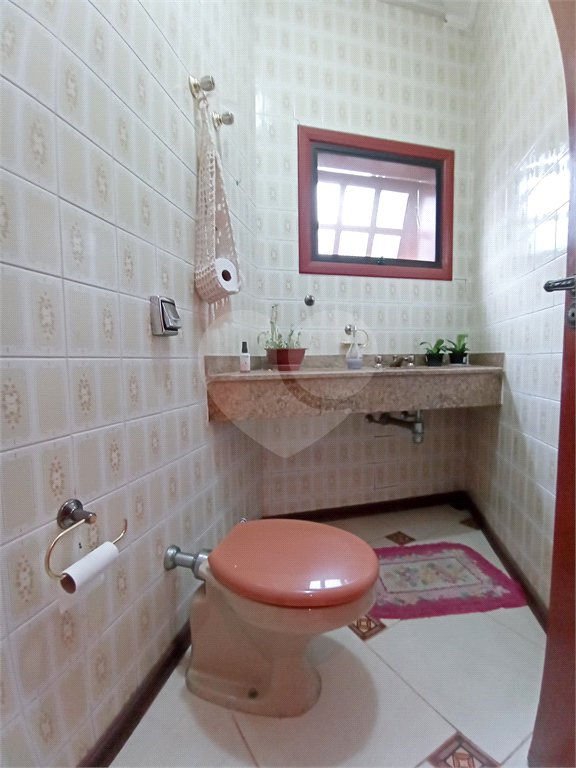 Casa à venda com 4 suítes no condomínio Estância Marambaia, Vinhedo - SP