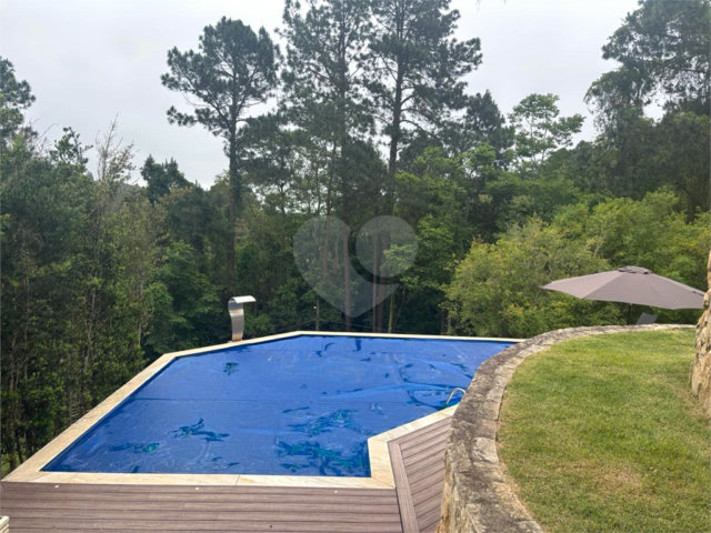 Casa à venda com 4 quartos, sendo 3 suítes, no condomínio Parque Itatiaia, Mairiporã - SP