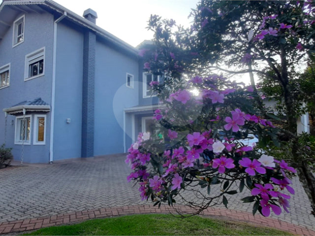 Casa à venda com 4 suítes no condomínio Suíça da Cantareira, Mairiporã - SP