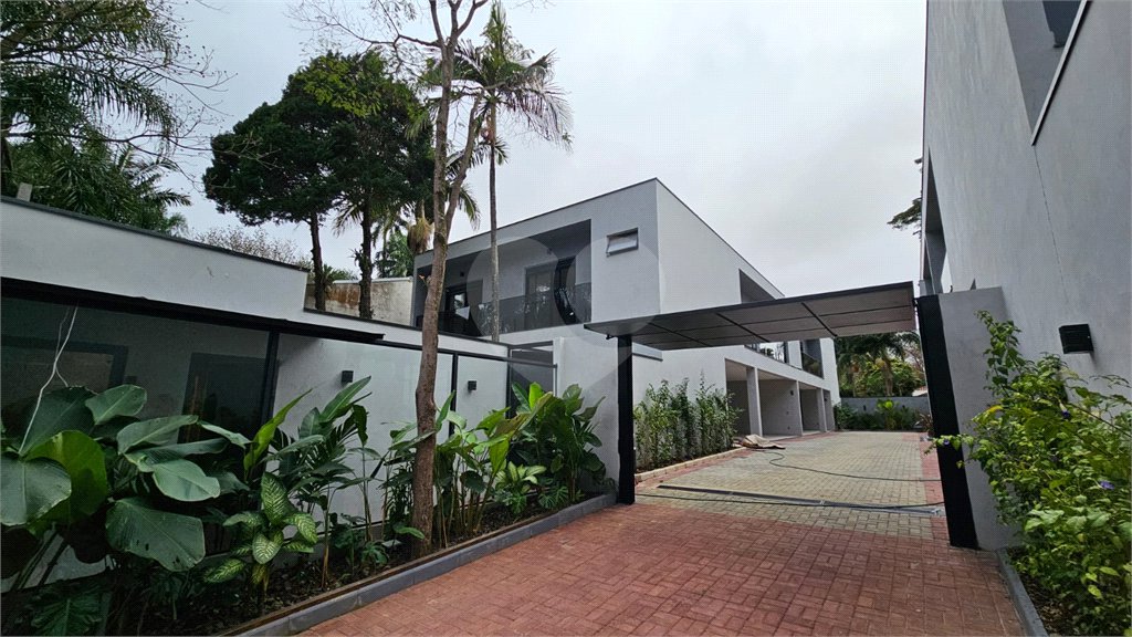 Casa à venda com 4 suítes no condomínio Villa Suiça, São Paulo - SP