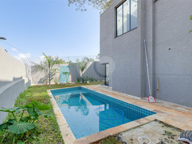 Casa à venda com 4 suítes no condomínio Reserva Robélia, São Paulo - SP