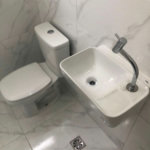 Casa com 3 dormitórios à venda, 116 m² por R$ 690.000,00 - Gonzaga - Santos/SP