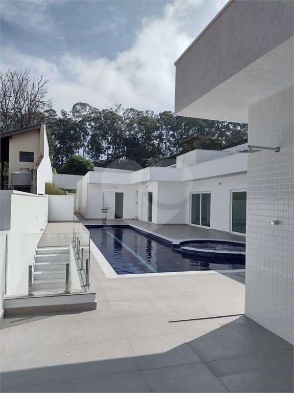 Casa à venda com 4 suítes no condomínio Estância Marambaia, Vinhedo - SP