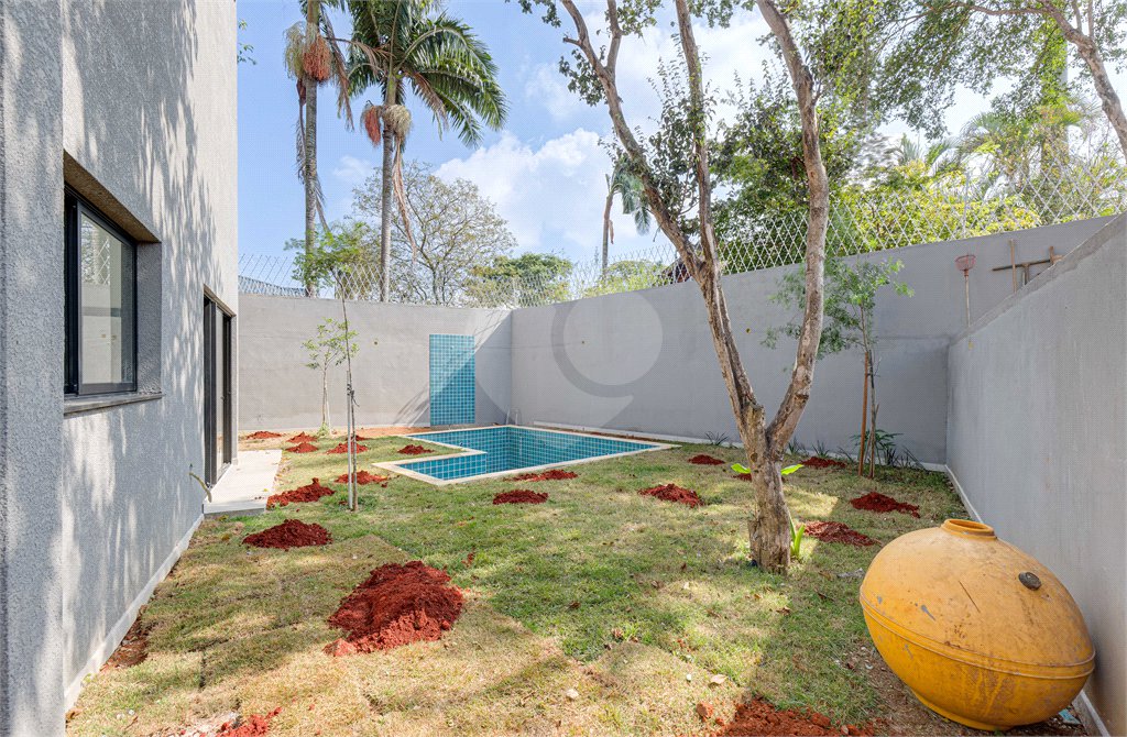 Casa à venda com 4 suítes no condomínio Reserva Robélia, São Paulo - SP
