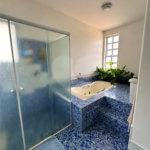 Casa à venda com 5 suítes no condomínio Residencial Bougainville, Campinas - SP
