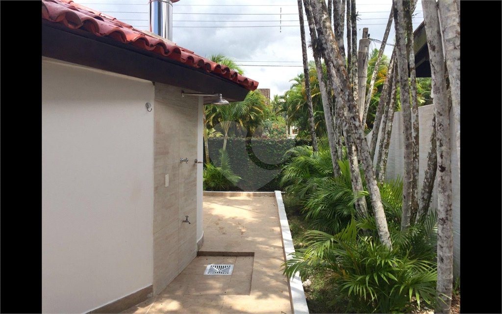Casa à venda com 8 quartos, sendo 6 suítes,  no condomínio Acapulco, Guarujá - SP
