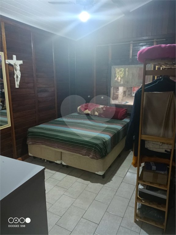 Casa à venda com 4 quartos, sendo 1 suíte,  no condomínio Morada da Praia, Bertioga - SP