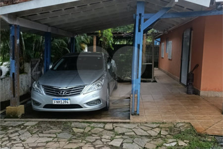 Casa à venda com 4 quartos, sendo 1 suíte,  no condomínio Morada da Praia, Bertioga - SP
