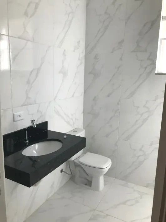 Casa com 3 dormitórios à venda, 116 m² por R$ 690.000,00 - Gonzaga - Santos/SP