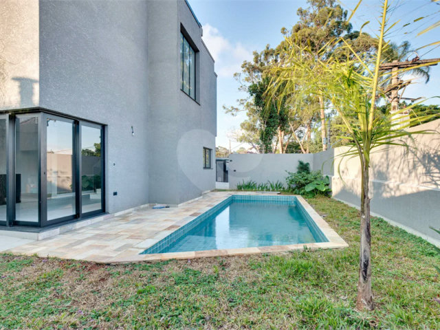 Casa à venda com 4 suítes no condomínio Reserva Robélia, São Paulo - SP