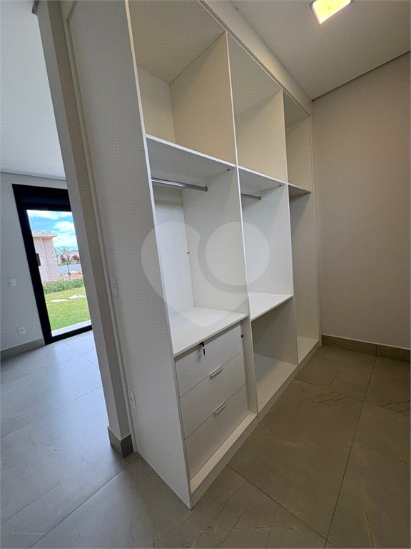 Casa à venda com 4 suítes no condomínio Portal dos Bandeirantes, Salto - SP