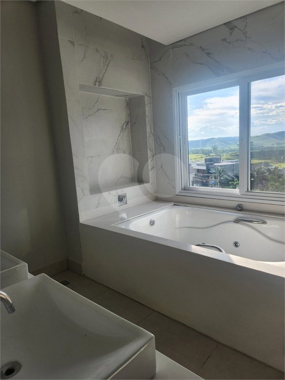 Casa à venda ou para alugar com 4 suítes no condomínio Residencial Jaguary, São José dos Campos - SP