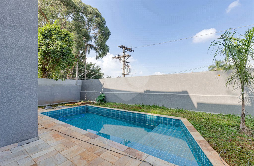 Casa à venda com 4 suítes no condomínio Reserva Robélia, São Paulo - SP