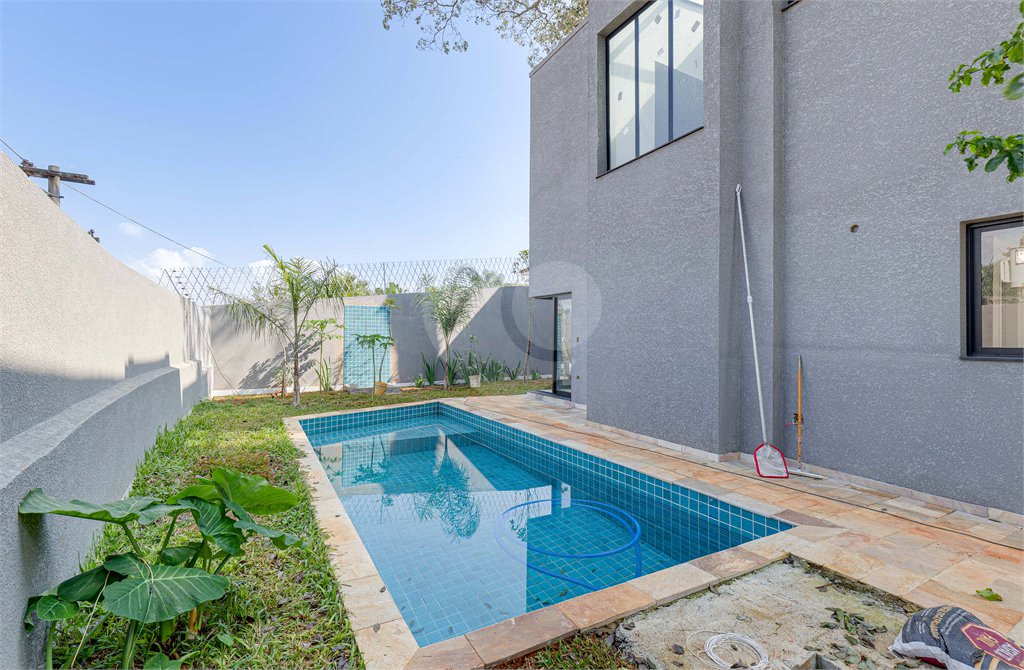 Casa à venda com 4 suítes no condomínio Reserva Robélia, São Paulo - SP