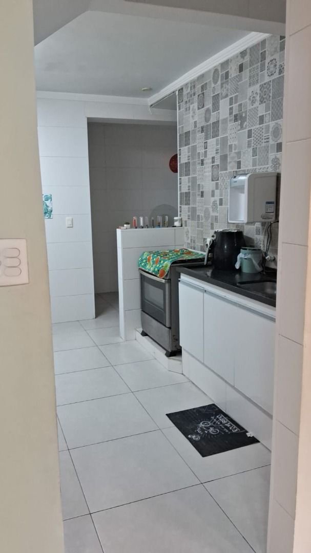 Sobrado com 3 dormitórios à venda, 150 m² por R$ 780.000,00 - Estuário - Santos/SP
