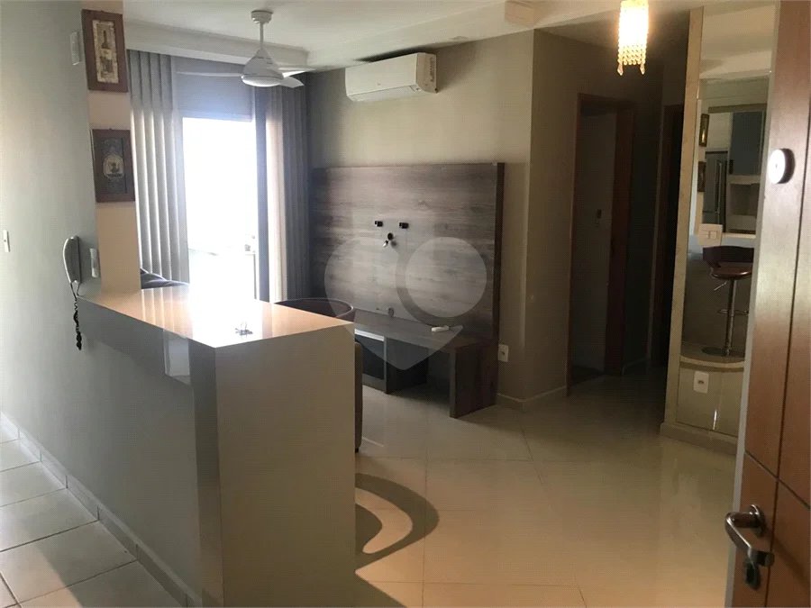 APARTAMENTO MOBILIADO EM FRENTE AO SHOPPING 02 DORMITÒRIOS