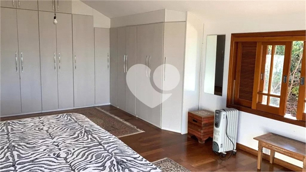 Casa à venda com 4 suítes no condomínio Suíça da Cantareira, Mairiporã - SP