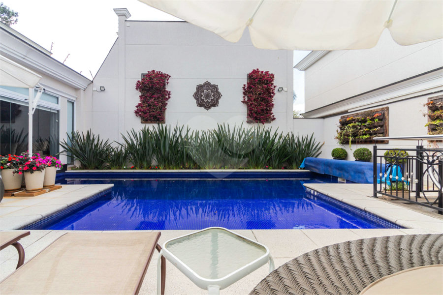Casa à venda com 4 suítes no condomínio Residencial Quinta das Andorinhas, São Paulo - SP