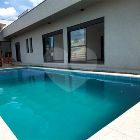 Casa à venda com 4 suítes no condomínio Figueira Garden, Atibaia - SP