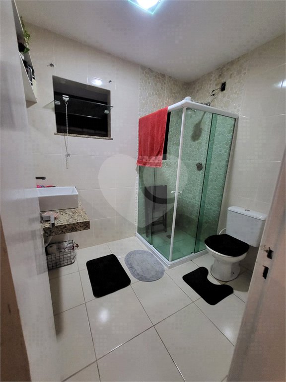 Casa à venda com 4 quartos, sendo 3 suítes, no condomínio Residencial Nelson Pinto, Rio de Janeiro - RJ